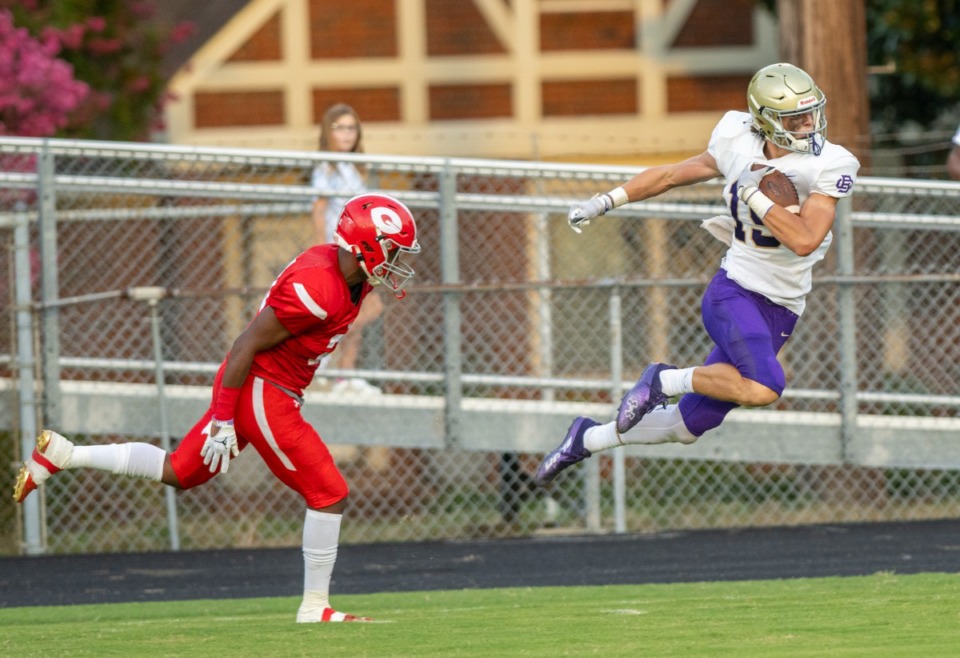 <strong>Germantown's Taeshawn Jefferson defends CBHS&rsquo;s Ryan Hall after Hall made a reception and long run to set up CBHS' second touchdown at Germantown High School, Saturday, Aug. 20, 2022.</strong> (Greg Campbell/Special to The Daily Memphian)