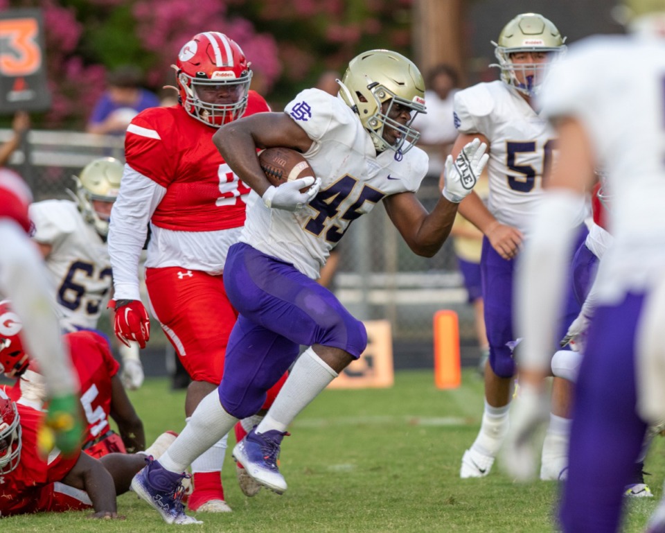 <strong>CBHS running back Aaron Jones breaks through the Germantown High defense to score the first touchdown of the game at Germantown High School, Saturday, Aug. 20, 2022.</strong> (Greg Campbell/Special to The Daily Memphian)