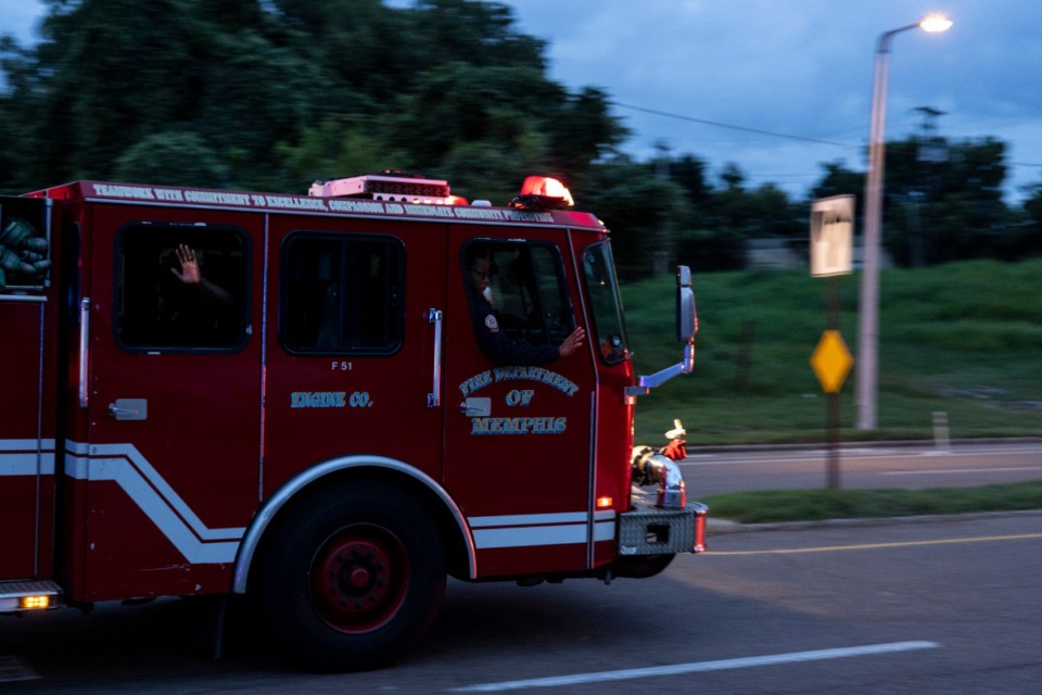 <strong>Emergency vehicles make their way along E.H.Crump Boulevard Sunday evening in memory of firefighter David Pleasant.</strong> (Brad Vest/Special to The Daily Memphian)