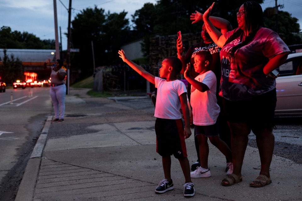 <strong>Passing vehicles&rsquo; red lights cast a glow on (from left) Carrion Cunningham, 5; Ladarius Shipp, 5; Cebrena Nelson and Cierra Davis Sunday evening.&nbsp;</strong>(Brad Vest/Special to The Daily Memphian)