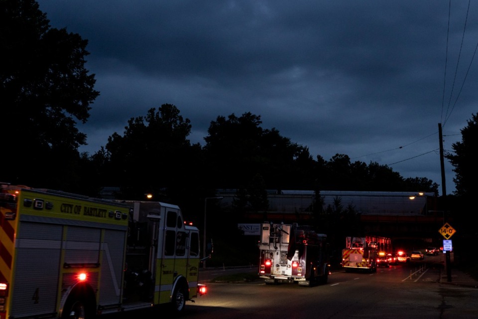 <strong>Emergency vehicles make their way along E.H.Crump Boulevard Sunday evening during the Memphis Fire Department&rsquo;s Sea of Red event honoring firefighter David Pleasant.</strong> (Brad Vest/Special to The Daily Memphian)