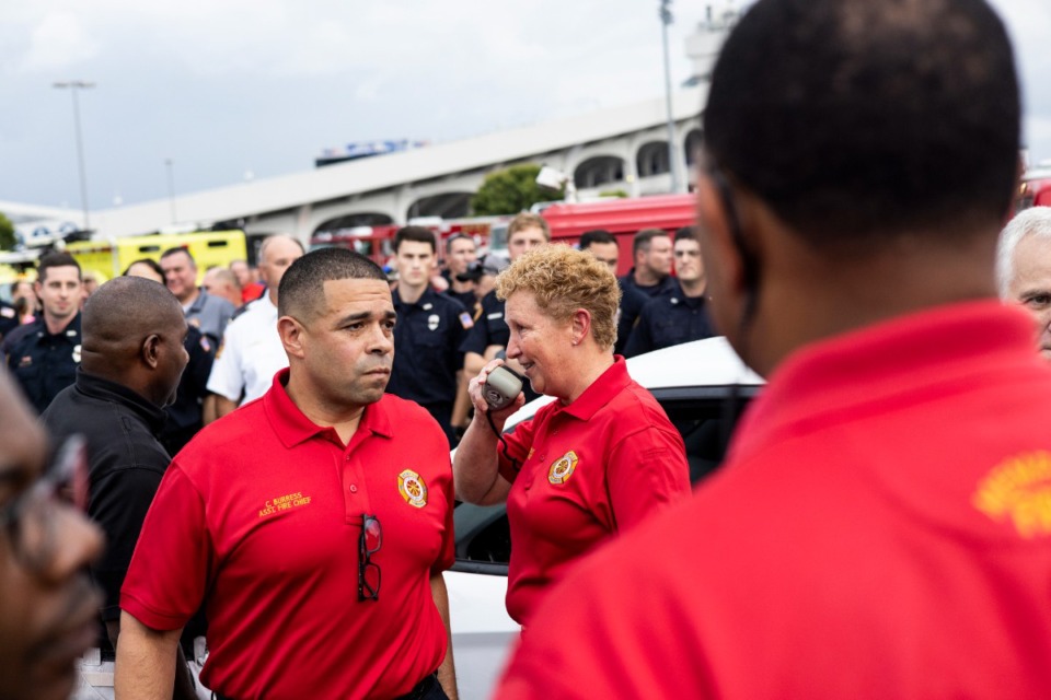 <strong>Chief Gina Sweat of Memphis Fire Department speaks at Tiger Lane before the start of the Sea of Red procession honoring firefighter David Pleasant.</strong> (Brad Vest/Special to The Daily Memphian)
