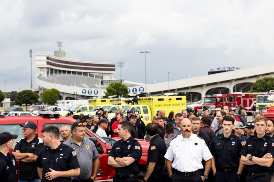 <strong>Firefighters gathered at Tiger Lane before the start of the Memphis Fire Department&rsquo;s Sea of Red event honoring firefighter David Pleasant on Sunday evening. The event started at Tiger Lane and ended at Fire Station 8 on Mississippi Boulevard.</strong> (Brad Vest/Special to The Daily Memphian)