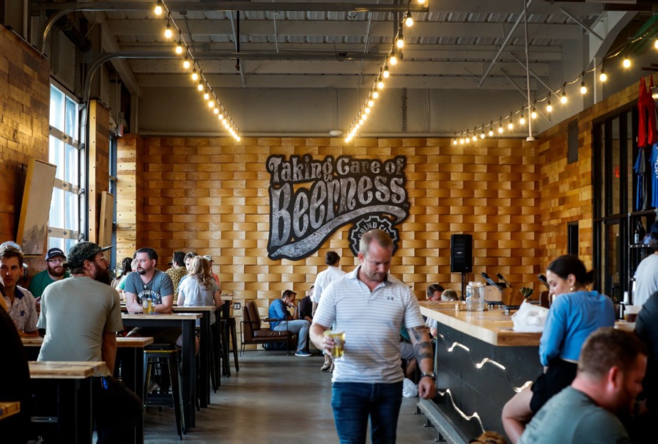 <strong>Grind City Brewing patrons enjoy the tasting room on Wednesday, July 21, 2021.&nbsp;The company will host its inaugural Grind City Fest this weekend. The event will include performances by national and local blues musicians.</strong> (Mark Weber/The Daily Memphian)