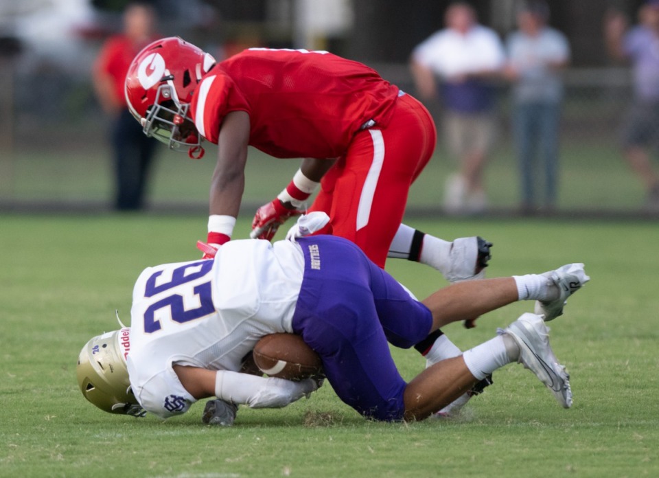 <strong>Germantown&rsquo;s Jamarion Morrow hovers over CBHS safety Charlie Harrell after an early interception on Aug. 20, 2022.</strong> (Greg Campbell/The Daily Memphian file)