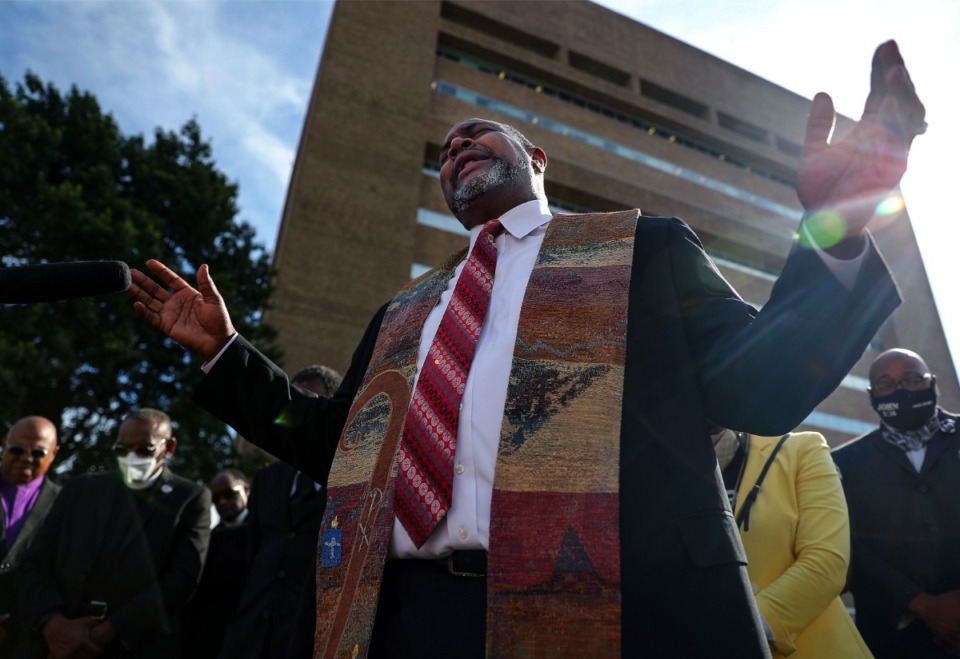 <strong>Pastor and University of Memphis professor Andre E. Johnson leads a prayer vigil for Pervis Payne outside of the Shelby County Criminal Justice Center June 4, 2021. Payne, who maintains his innocence, currently sits on death row in Tennessee despite having a mental disability.</strong> (Patrick Lantrip/The Daily Memphian)