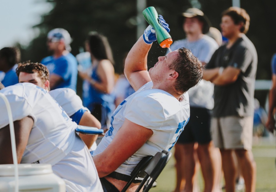 <strong>Memphis Tigers offensive lineman Evan Fields, cools off on the sideline after what turned out to be a hot day for a scrimmage in August 2018.</strong> (Daily Memphian file)