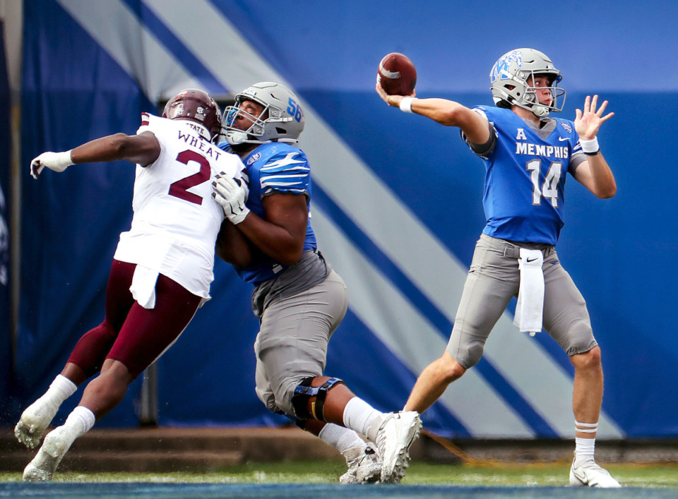 <strong>University of Memphis quarterback Seth Henigan (14) throws a short pass during last year&rsquo;s win over Mississippi State. Henigan will lead the Tigers into Saturday&rsquo;s game against the Bulldogs with the confidence of his coaches and teammates.</strong> (Patrick Lantrip/Daily Memphian file)