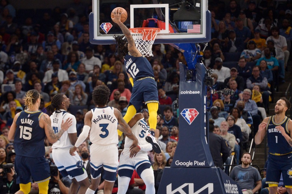 <strong>Memphis Grizzlies guard Ja Morant (12) dunks the ball against Minnesota Timberwolves guard Malik Beasley (5) in the second half during Game 5 of a first-round NBA basketball playoff series Tuesday, April 26, 2022, in Memphis, Tenn.</strong> (AP Photo/Brandon Dill)