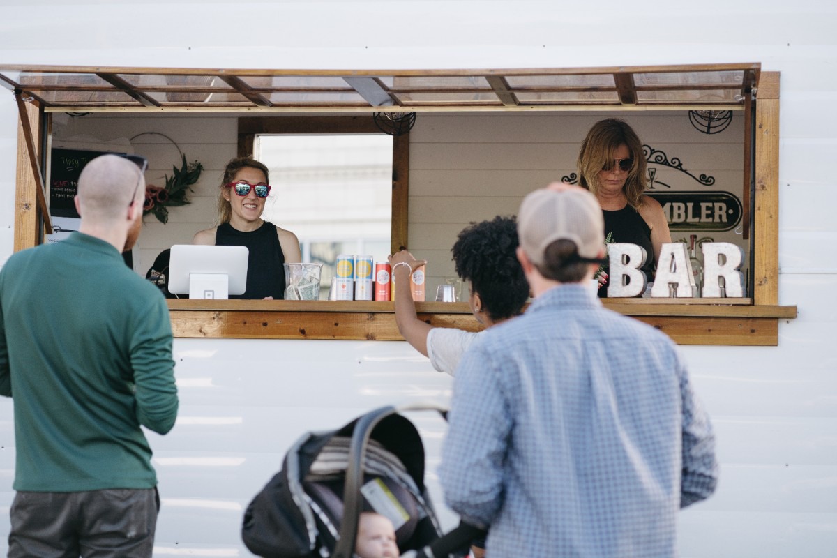 <strong>Festival-goers enjoy drinks from the pop-up bar at the Rockwalk Festival in the Edge District on Sept. 1, 901 Day.</strong> (Lucy Garrett/Special to The Daily Memphian)