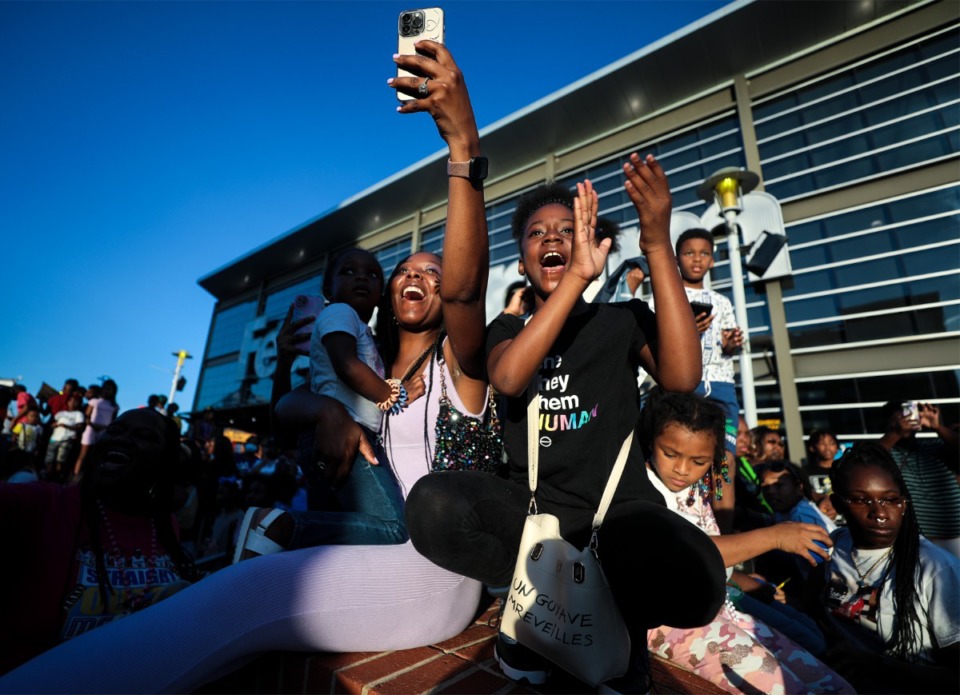 <strong>A group of people cheer for rapper Big Boogie during the 901 Day Grizz Bash held outside of FedExForum on Sept. 1, 2022.</strong> (Patrick Lantrip/Daily Memphian)