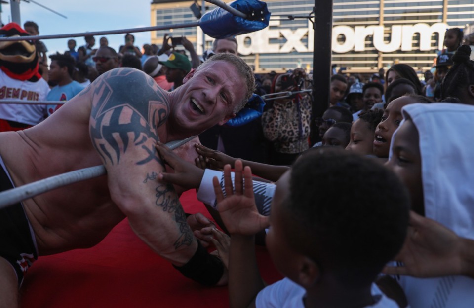 <strong>Fans cheer on a victorious wrestler during the 901 Day Grizz Bash held outside of FedExForum on Sept. 1, 2022.</strong> (Patrick Lantrip/Daily Memphian)
