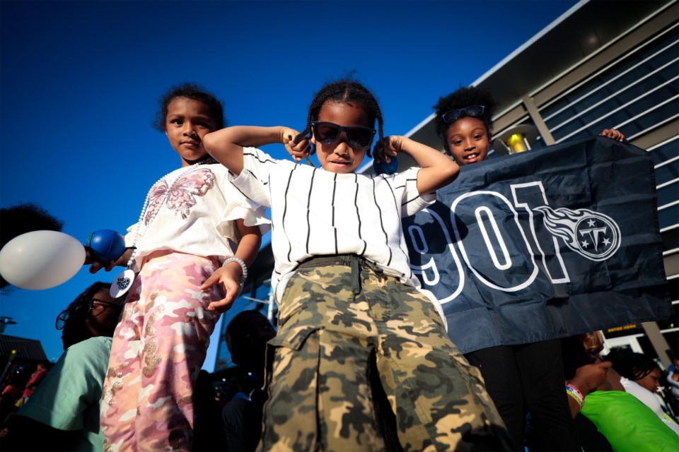 <strong>Ivy Smith (from left), Christian Darnell and Devonna Smith pose for a during The 901 Day Grizz Bash held outside of FedExForum Sept. 1, 2022.</strong> (Patrick Lantrip/Daily Memphian)