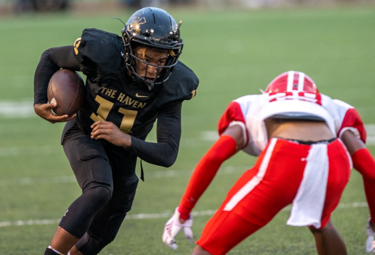 <strong>After making a reception, Whitehaven's William Carver squares up with Germantown's Jabari Jackson on Sept. 2, 2022.</strong> (Greg Campbell/Special for The Daily Memphian)