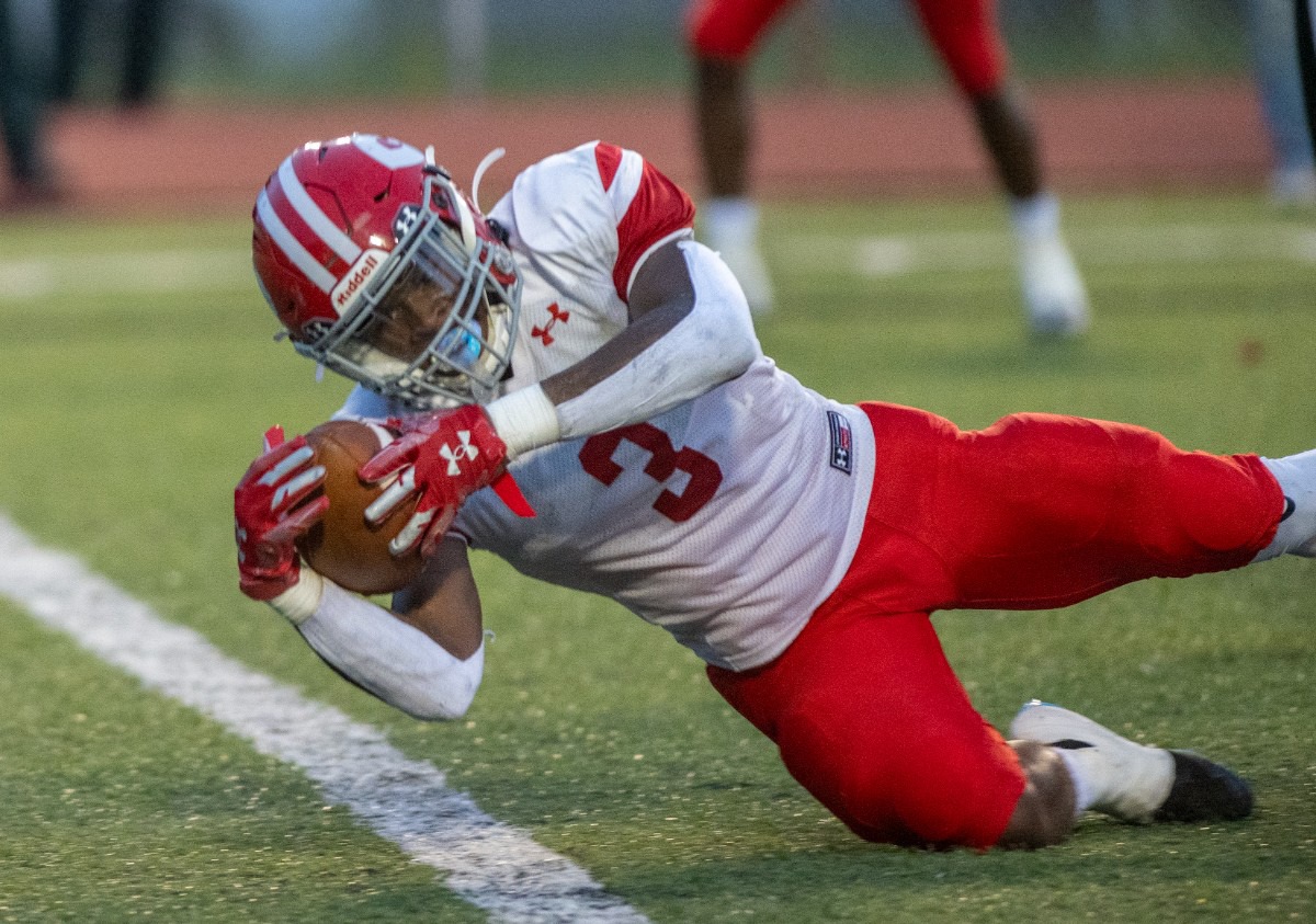 <strong>Germantown's Malik Mason fights to cross the goal line for a first quarter touchdown at Whitehaven High School on Friday, Sept. 2, 2022.</strong> (Greg Campbell/Special to The Daily Memphian)