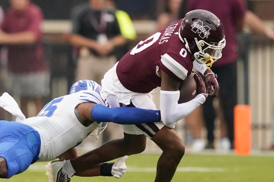 <strong>Memphis defensive back Quindell Johnson (15) tackles Mississippi State wide receiver Rara Thomas (0) during the first half of an NCAA college football game in Starkville, Miss., Saturday, Sept. 3, 2022.</strong> (Rogelio V. Solis/AP)