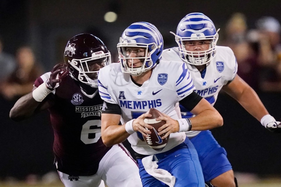 <strong>Mississippi State defensive end Jordan Davis (6) pressures Memphis quarterback Seth Henigan (5) during the second half of an NCAA college football game in Starkville, Miss., Saturday, Sept. 3, 2022. Mississippi State won 49-23. </strong>(AP Photo/Rogelio V. Solis)