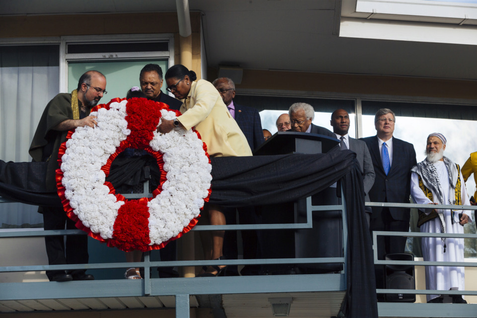 <strong>Dr. Omid Safi (from left), director of Islamic Studies at Duke University,&nbsp;Rev. Jesse Jackson and National Civil Rights Museum president Terri Lee Freeman lay a memorial wreath on the balcony of the Lorraine Motel April 4, 2019, at the annual observance of Dr. Martin Luther King Jr.'s assassination.</strong> (Ziggy Mack/Special to The Daily Memphian)