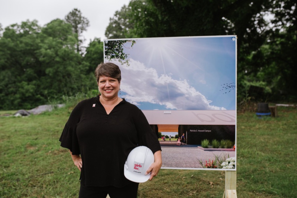 <strong>&ldquo;Legislators are making it more difficult to have honest conversations about safe and healthy sexuality, and the consequences of that could be huge,&rdquo; said Lisa Moore, president and CEO of&nbsp;Girls Inc. in Memphis. Moore is pictured June 10, 2021, with architectural renderings of the new Patricia C. Howard Campus.</strong> (Lucy Garrett/Special to The Daily Memphian file)