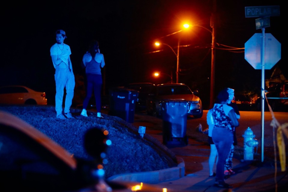 <strong>Onlookers gather as police work a crime scene on Poplar during the active-shooter emergency.</strong> (Mark Weber/The Daily Memphian)