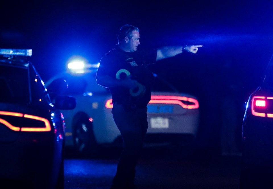 <strong>A Memphis Police officer puts up crime scene tape at an active shooter scene in Whitehaven on Sept. 7, 2022.</strong> (Patrick Lantrip/Daily Memphian)