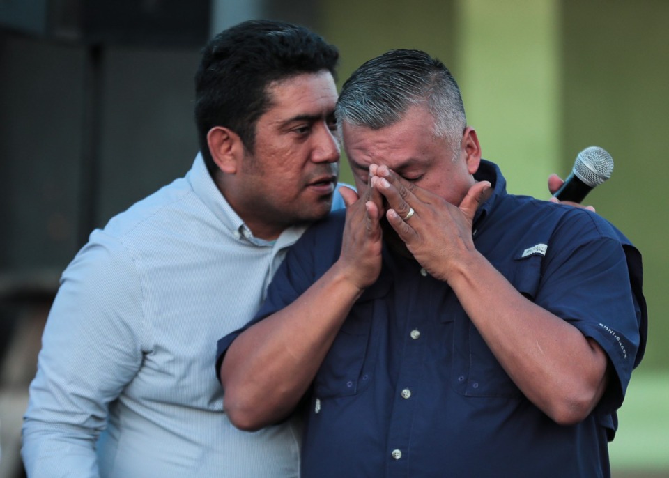 <strong>Rolando Rostero wipes his eyes while listening to a speaker at the vigil outside the AutoZone at 4011 Jackson Ave. on Sept. 8, held to mourn the victims of a Sept. 7 shooting spree.</strong> (Patrick Lantrip/Daily Memphian)