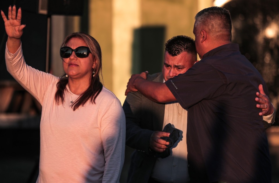 <strong>Rolando Rostero hugs his friend on Sept. 8, during the vigil to mourn the victims of the shooting spree the day before.</strong> (Patrick Lantrip/Daily Memphian)