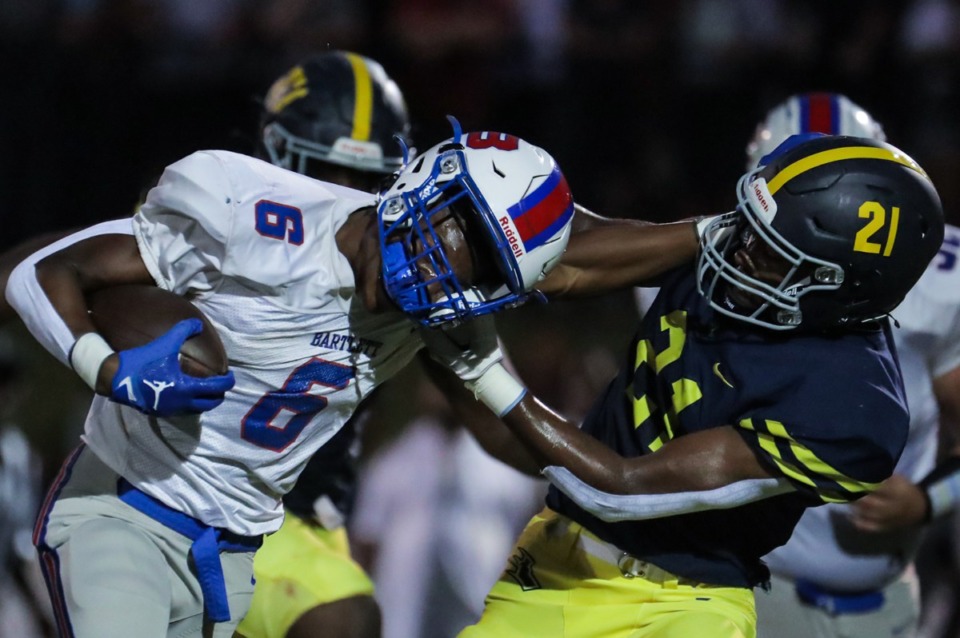 <strong>Lausanne defensive back Langston Rodgers (21) tries to bring down Bartlett running back Geron Johnson (6) during the Sept. 9, 2022, game.</strong> (Patrick Lantrip/Daily Memphian)
