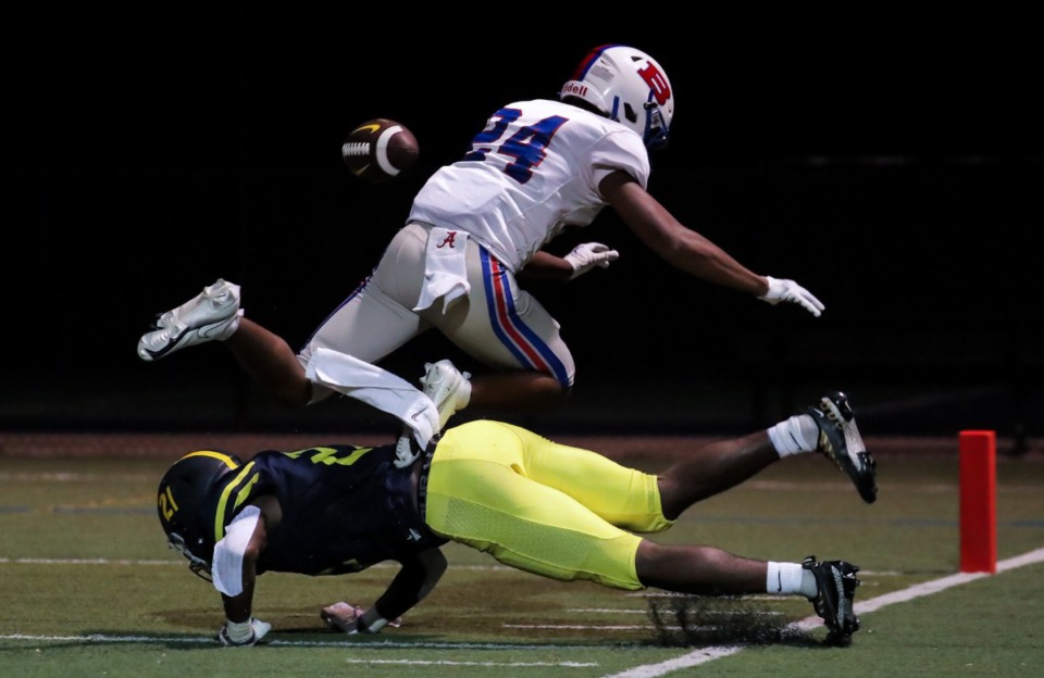 <strong>Bartlett receiver Devin Rutherford (24) and Lausanne defensive back Langston Rodgers (21) get tangled up on a pass play on Sept. 9.</strong> (Patrick Lantrip/Daily Memphian)