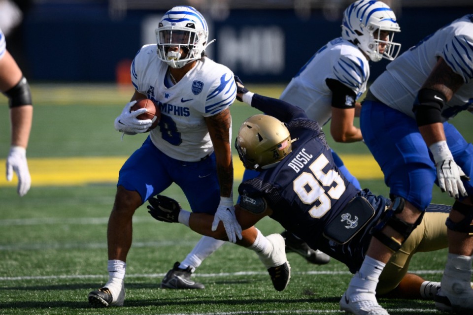 <strong>Memphis running back Jevyon Ducker (8) runs with the ball against Navy defensive end Jacob Busic (95) during the first half of an NCAA college football game, Saturday, Sept. 10, 2022, in Annapolis, Md.</strong> (Nick Wass/AP)