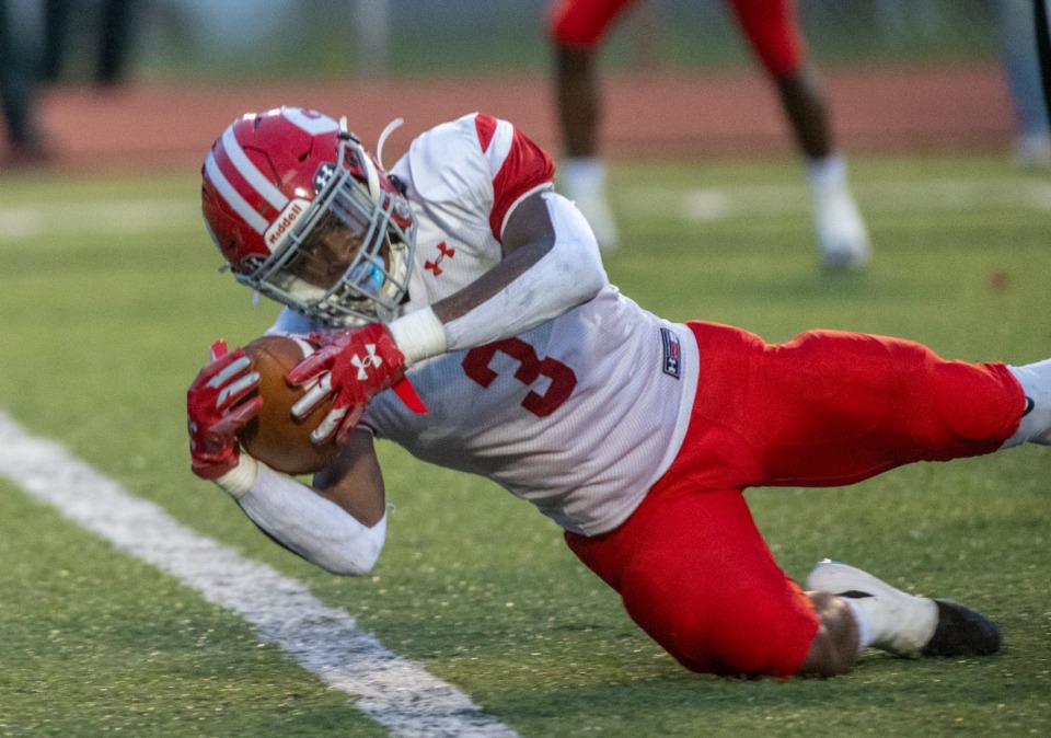 <strong>Germantown's Malik Mason fights to cross the goal line for a first quarter touchdown at Whitehaven High School, Friday, Sept. 2, 2022. Germantown is ranked No. 5 in Div. 1 6A.</strong> (Greg Campbell/The Daily Memphian file)