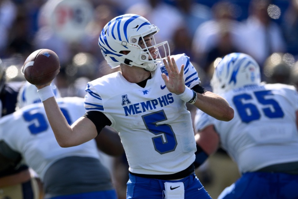 <strong>Memphis quarterback Seth Henigan (5) looks to pass during the first half of an NCAA college football game against Navy, Saturday, Sept. 10, 2022, in Annapolis, Md. The Tigers will play their first home game of the season Saturday against Arkansas State.</strong> (Nick Wass/AP)