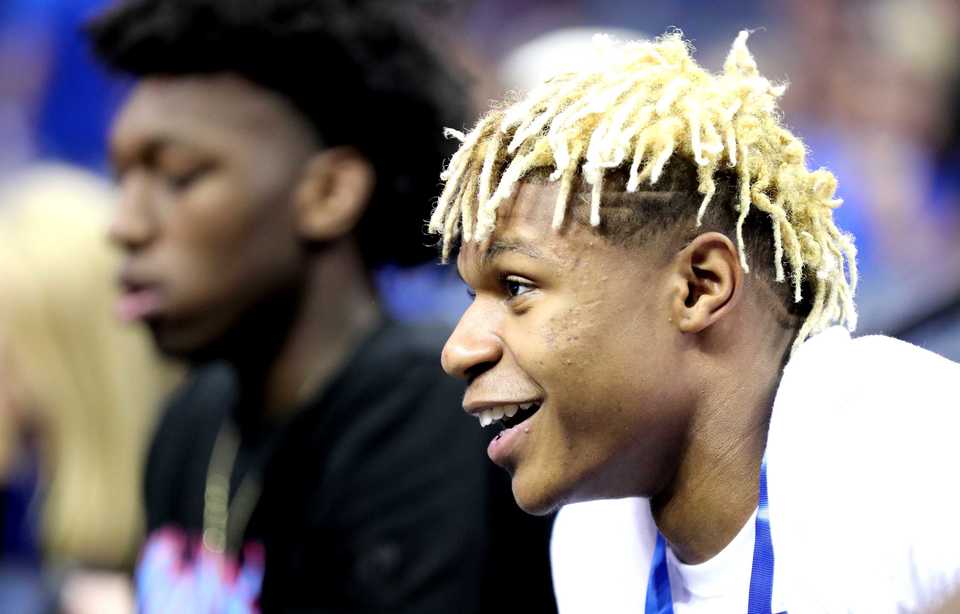 <strong>Jahmius Ramsey (right), a recruit for the Memphis Tigers basketball team, watches the Tigers scrimmage during Memphis Madness at FedExForum.</strong> (Houston Cofield/Daily Memphian)