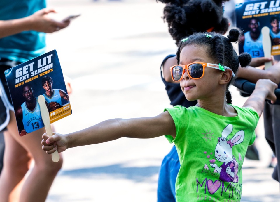 <strong>Charlotte Jones, 5, listens to live music on Young Avenue during the annual Cooper-Young Festival in 2019. The festival drew thousands of visitors to enjoy live music, local artwork and food.</strong> (The Daily Memphian file)
