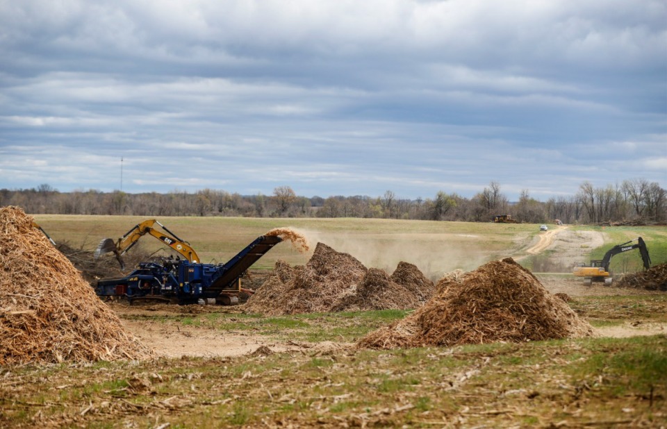 <strong>Construction crews mulch trees at the BlueOval City site on April 8.</strong> (Mark Weber/The Daily Memphian)