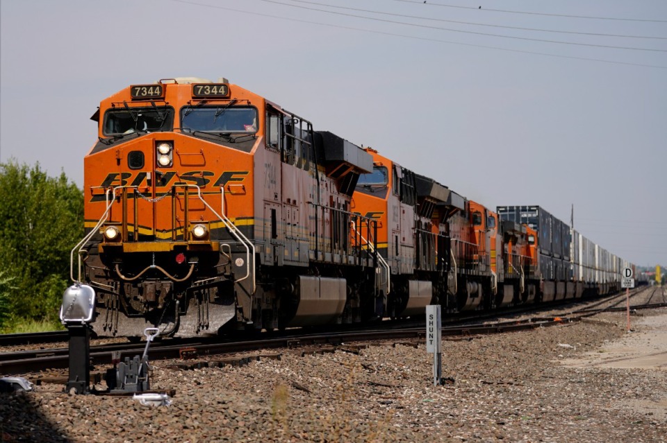 <strong>A BNSL locomotive leads a long line of freight cars Wednesday, Sept. 14, 2022, in Oklahoma City. Business and government officials are preparing for a potential nationwide rail strike at the end of this week while talks carry on between the largest U.S. freight railroads and their unions.</strong> (AP Photo/Sue Ogrocki)