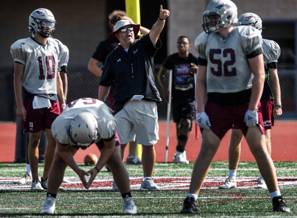 <strong>Collierville head coach Joe Rocconi (middle) gives direction during practice. The Dragons have won 14 consecutive regular-season games&nbsp;&mdash; including four to start the 2022 season.</strong> (Mark Weber/The Daily Memphian)