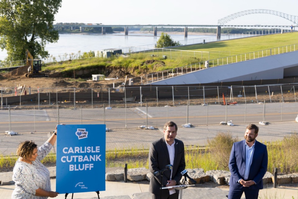 <strong>Chance Carlisle (center) and Chase Carlisle (right) speak during a press conference Thursday, Sept. 15, announcing that the bluff overlooking Tom Lee Park is being named Carlisle Cutbank Bluff.</strong> (Brad Vest/Special to The Daily Memphian)