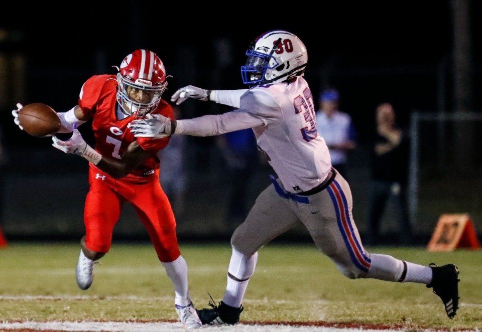 <strong>Germantown&rsquo;s Kion Threalkill (left) breaks free of Bartlett&rsquo;s Austin Howard (right) on his way to a touchdown on Friday, Sept. 16, 2022.</strong> (Mark Weber/The Daily Memphian)
