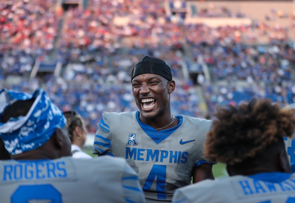<strong>University of Memphis receiver Javon Ivory (4) jokes with teammates on the sidelines during a Sept. 17, 2022 game against Arkansas State University.</strong> (Patrick Lantrip/Daily Memphian)