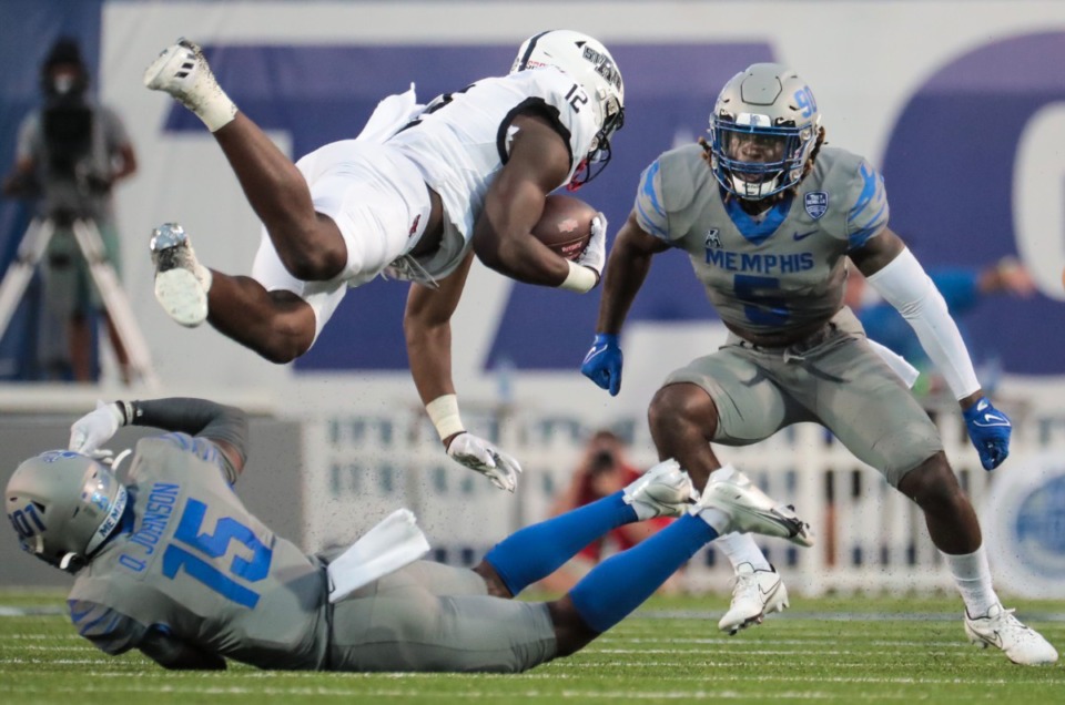 <strong>University of Memphis defensive back Quindell Johnson (15) brings down an Arkansas State University player during a Sept. 17, 2022 game.</strong> (Patrick Lantrip/The Daily Memphian)