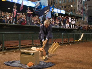 <strong>Peter Freund, principal owner of Memphis 901 FC, smashes a guitar at the inaugural game against Tampa Bay at AutoZone Park.&nbsp;When the team returns to AutoZone Park on Wednesday, April 10, it will have its most famous smasher to date, University of Memphis football coach Mike Norvell.</strong>&nbsp;(Photo courtesy of 901 FC)