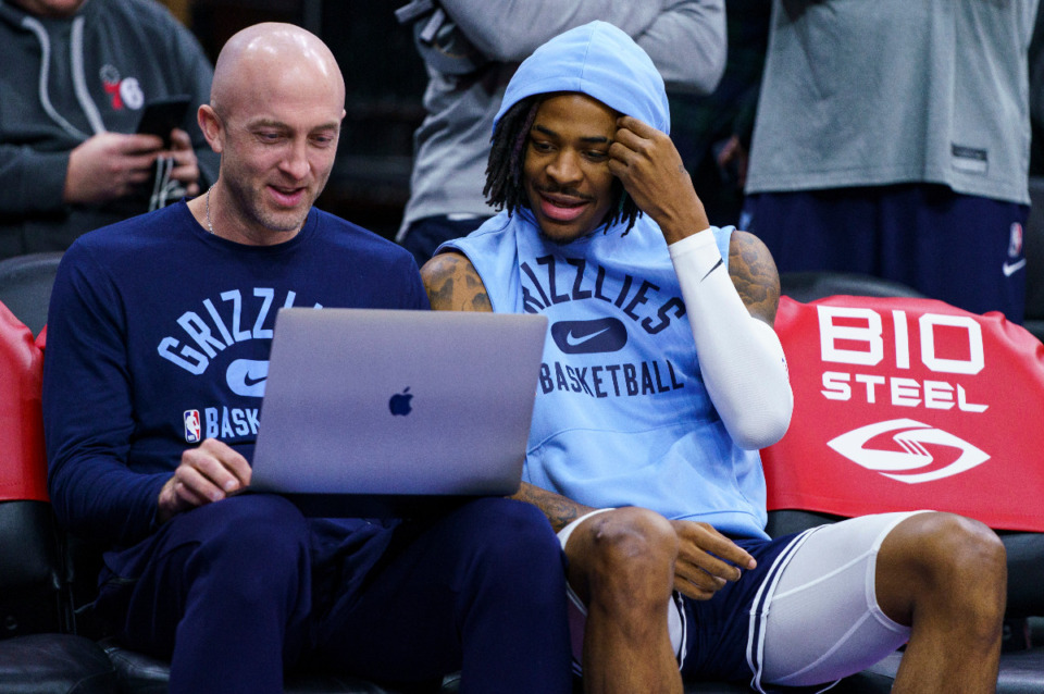 <strong>Memphis Grizzlies' Ja Morant, right, looks over the laptop with assistant coach Blake Ahearn, left, prior to the first half of an NBA basketball game against the Philadelphia 76ers, Monday, Jan. 31, 2022, in Philadelphia.</strong> (AP file Photo/Chris Szagola)