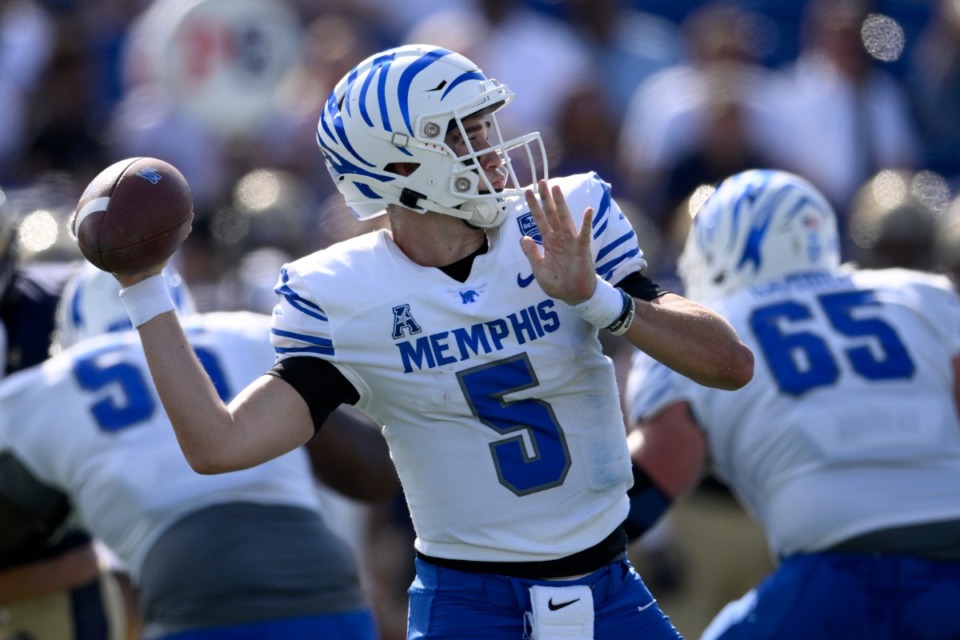 <strong>Memphis quarterback Seth Henigan (5) looks to pass during the first half of an NCAA college football game against Navy, Saturday, Sept. 10, 2022, in Annapolis, Md.</strong> (AP Photo/Nick Wass)