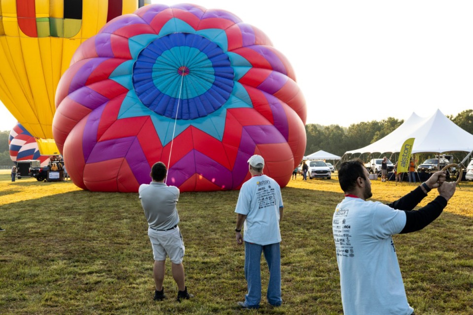 <strong>Volunteers and spectators gathered Saturday and Sunday mornings for the ascension of the balloons.</strong> (Brad Vest/Spectal to The Daily Memphian)