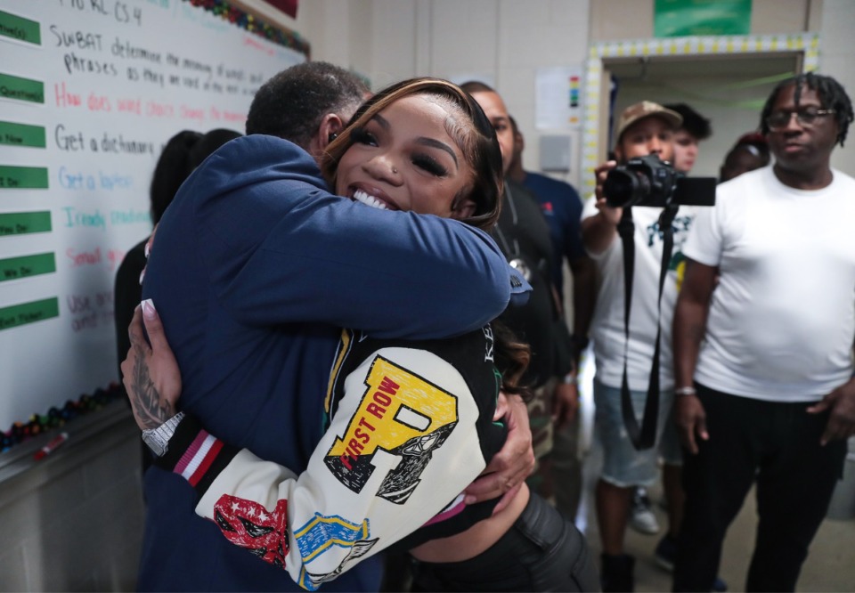 <strong>Rapper GloRilla hugs her former principal Frayser Community Schools founder Bobby White while visiting her old school, MLK College Preparatory High School Sept. 22, 2022.</strong> (Patrick Lantrip/Daily Memphian)