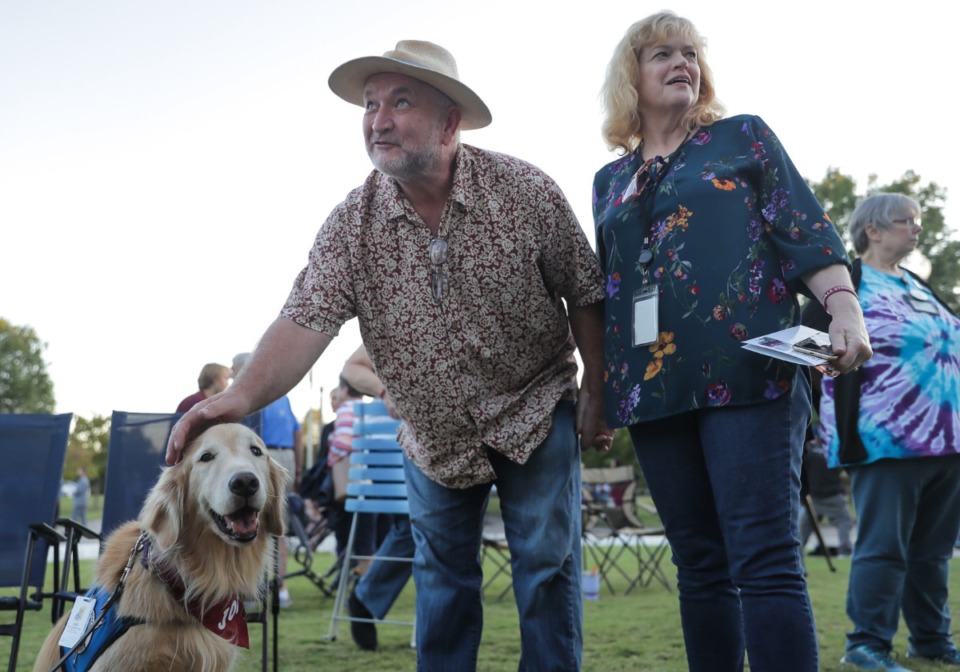 <strong>Cecil and Susan Yancy pet therapy dog Job during the vigil at Collierville Town Hall on Sept. 23, 2022.</strong> (Patrick Lantrip/The Daily Memphian)