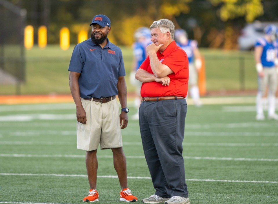 <strong>Ridgeway High School head coach Duron Sutton, left, talks with MUS head coach Bobby Alston before the game.&nbsp;</strong>(Greg Campbell/Special to The Daily Memphian)