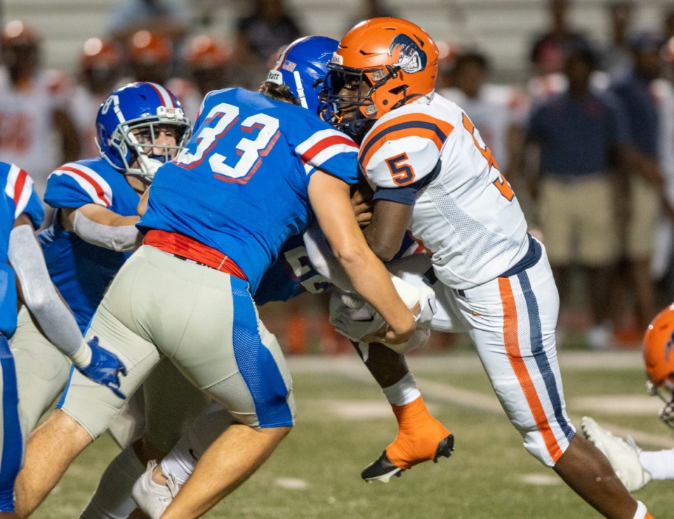 <strong>Ridgeway running back Cameron Cage is met by MUS defender Stryker Aitken in Friday's game at MUS.&nbsp;</strong>(Greg Campbell/Special to The Daily Memphian)