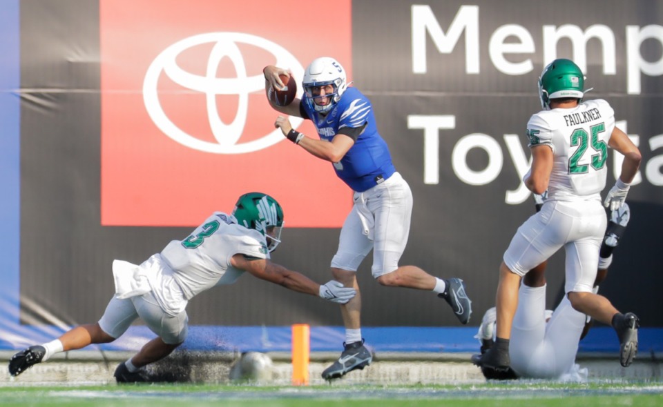 <strong>University of Memphis quarterback Seth Henigan (5) dodges a tackle during a Sept. 24, 2022 game against University of North Texas.</strong> (Patrick Lantrip/The Daily Memphian)